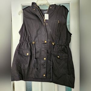 Zip up vest with hood.